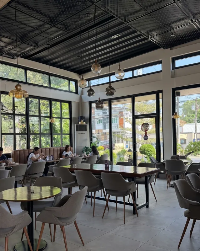 Manna's window room with steel windows and grey shell chairs